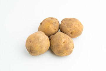 Fototapeta premium Small pile of fresh raw brown baby potatoes isolated on white background