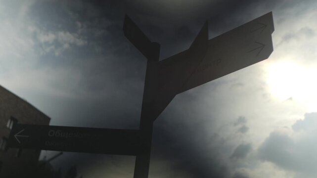 Dark storm clouds hover above a wooden signpost. Sunlight breaks through the heavy clouds. Multiple arrows point in different directions. This captures ambiguous choices amid unpredictable weather