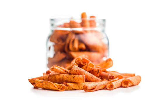 Spicy Rolled Corn Chips Stack Closeup On White Background For Snack Food Advertising