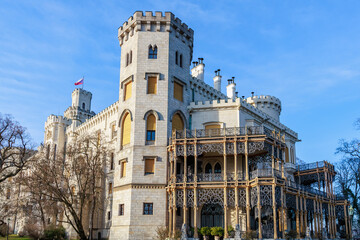 Majestic european castle with flag in scenic landscape © Iurii Gagarin