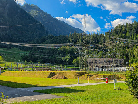 hydroelectric power station and electrical substation in a scenic alpine mountain valley
