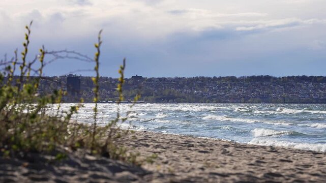 V&auml;tterstranden beach with Bymarken and Gr&auml;ddhyllan across Lake V&auml;ttern