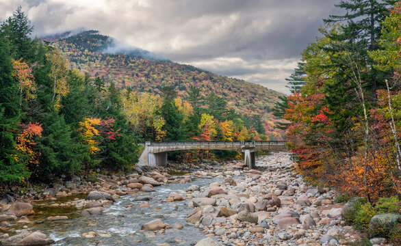 Autumn colors on the Lincoln Woods Trail over the Pemigewasset River view towards the Kancamagus Scenic Highway - New Hampshire