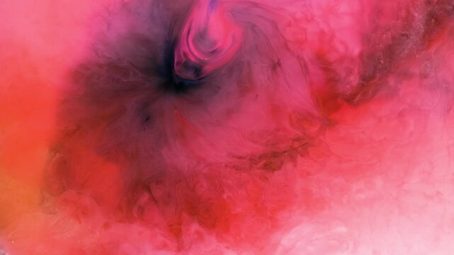 Mixing different colored alcohol inks in a close-up view