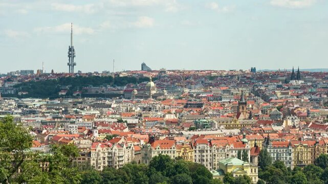 Prague historic center panoramic view features tile roof houses and Zizkov TV Tower. Scenic European urban architecture extends to horizon. Concept of capital city travel destination.