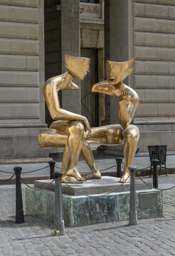 Havana, Cuba, March 31, 2022, La Conversation by Etienne, two artistic, contemporary, gold mimes sitting together having a conversation