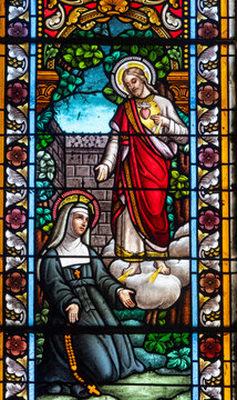 Stained glass (19th century) of Vision of Sacred Heart of Jesus Christ to Saint Margaret Mary Alacoque.