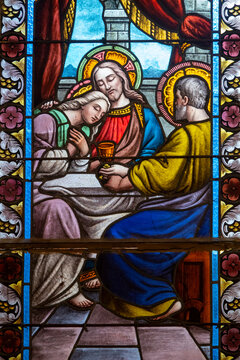 Stained glass showing Jesus with beloved disciple John.