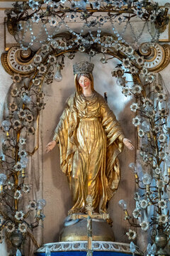 Statue (19th century) of Virgin Mary blessing.