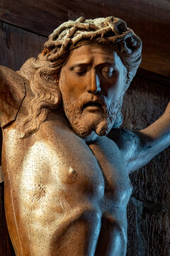 Sculpture of Face of Jesus Christ crucified on the cross with the crown of thorns.