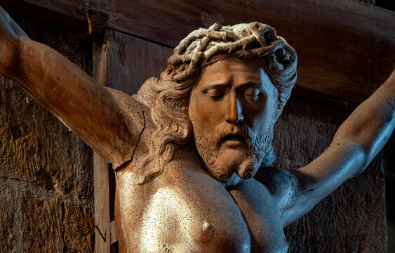 Sculpture of Face of Jesus Christ crucified on the cross with the crown of thorns.