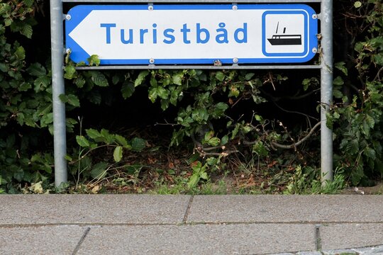Tourist boat road sign and direction in Skanderborg called turistbad in Danish language