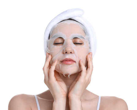 Beautiful woman with sheet face mask on white background