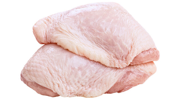 Two raw chicken thighs with skin, stacked and isolated on transparent background