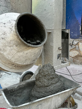 Mobile concrete mixer preparing construction mixture.