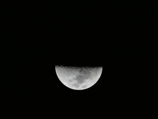 Half Moon Illuminated Against a Dark Night Sky © Sven Decker