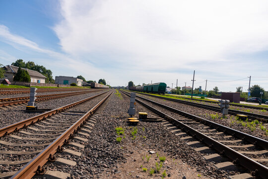 Railway Tracks and Freight Trains at Rural Railroad Station.