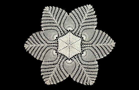 Crochet lace patterns, one crocheted Grandma's Doily, detail of hand-crocheted embroidery, tablecloth, napkin isolated on black background border art design. Craft, vintage linen. Hobby concept, flat 