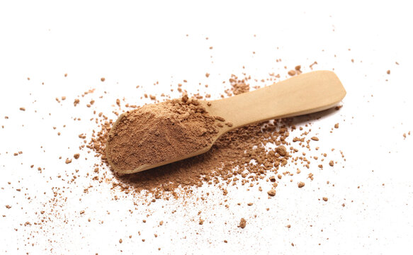 Pile ground chocolate, powder in wooden spoon isolated on white background, top view, clipping path