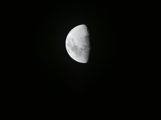 Detailed Half Moon Illuminated Against a Black Night Sky in Paraguay © Sven Decker