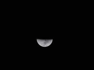 Half Moon Glowing in the Dark Night Sky in Paraguay © Sven Decker