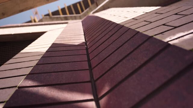 Brick wall facade viewed from below at construction site low angle