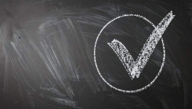 Checkmark symbol drawn with white chalk inside a circle on a messy black chalkboard background for educational business concepts