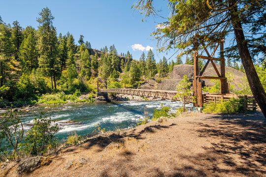 The wooden suspension bridge crossing over the Spokane River at the Bowl and Pitcher area of Riverside State Park in Spokane, Washington State, USA