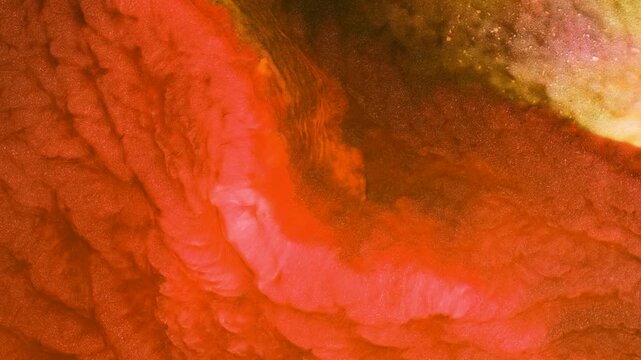 Mixing different colored alcohol inks in a creative close-up view