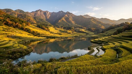 Fototapeta premium Autumn Rice Terraces Surrounding a Mountain Lake in a Rural Landscape