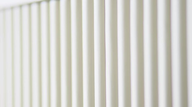 Abstract close up of a modern white corrugated fluted texture panel pattern