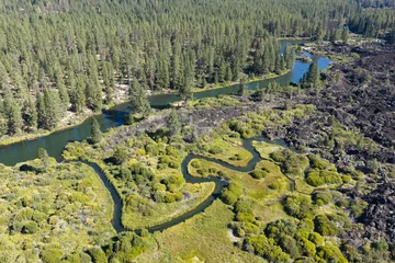 The scenic Deschutes River is a scenic 252-mile tributary of the Columbia River in Central Oregon. It flows through Bend and offers whitewater kayaking, rafting, paddle boarding, and great fishing. © ead72