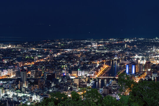Panoramic night view of Tokushima city center from the summit of Mount Bizan.