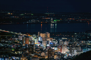 Fototapeta premium Panoramic night view of Tokushima city center from the summit of Mount Bizan.