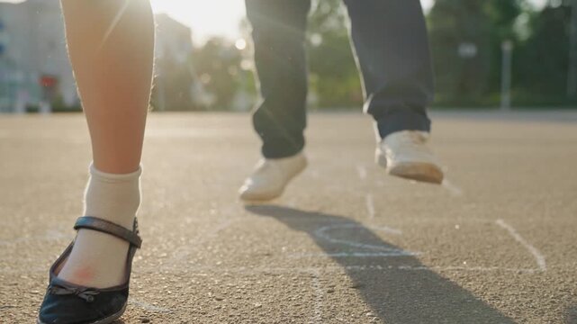 Kid child baby boy girl happy family, child dream, Childhood hopscotch game, sunny playtime, jump in motion, school shoes close-up, white sock style, playground nostalgia, early school morning, youth