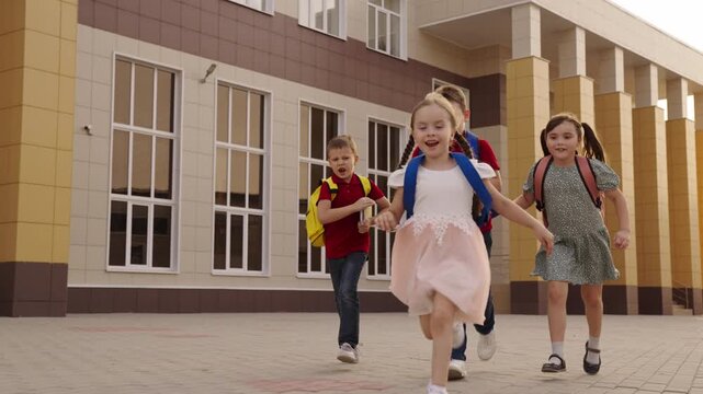 school entrance view, kids loving school, kids with backpacks, knowledge seekers, children's education, running to learn, playground memories, children entering the building, schoolyard scene, kids