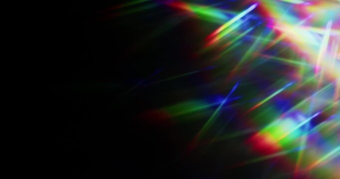 Lights shining into a prism causing an optical effect of a brilliant rainbow of dancing light rays. Light reflect creating a visual of a dreamy burst of light shining and sparkling. Seamless Loop.