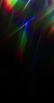 Lights shining into a prism causing an optical effect of a brilliant rainbow of dancing light rays. Light reflect creating a visual of a dreamy burst of light shining and sparkling. Seamless Loop.