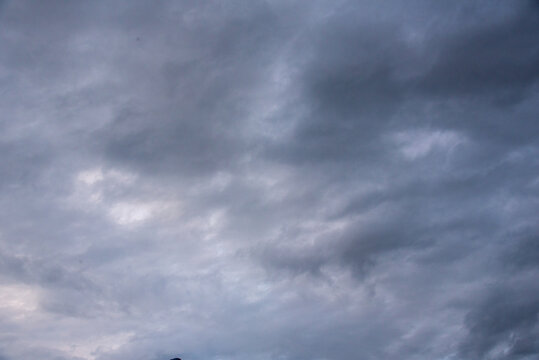 Dark gray sky cloudy environment. Nimbus raincloud skyline climate background. Dark rain cloud dramatic sky summer tropical thunder storm sky and fluffy black darkness cloud nearly raining cloudscape