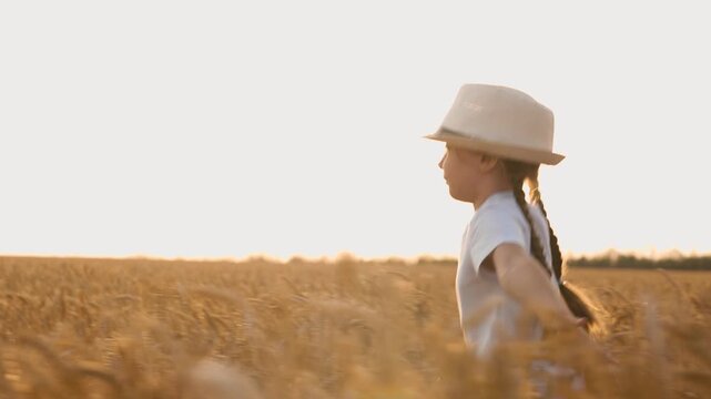 agriculture, wheat field, golden wheat farm field sunset, little girl running through wheat field at sunset, child kid girl daughter running at sunset, child in hat at sunset, happy family, superhero