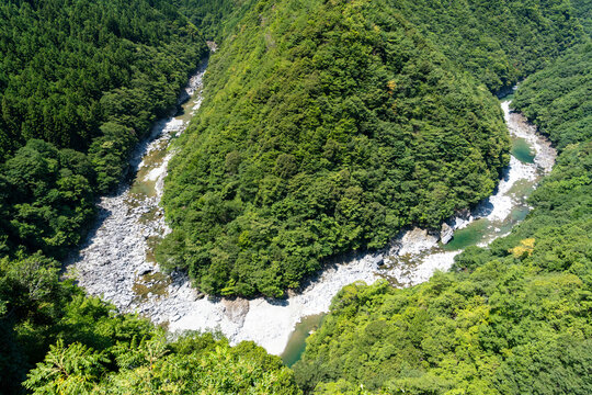 High-angle view of the Hinoji Valley where the Iya River meanders in the shape of the Hiragana character 'Hi' in Tokushima, Japan.