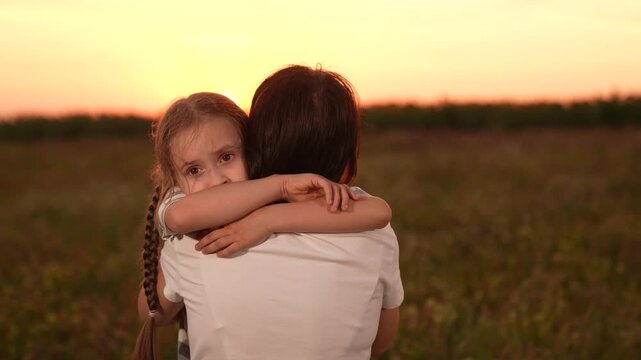 Mother child comforting sad daughter at sunset, emotional family moment outdoors, girl child kid hugging mom after a long day, loving embrace nature, parent child support during hard times, expressing