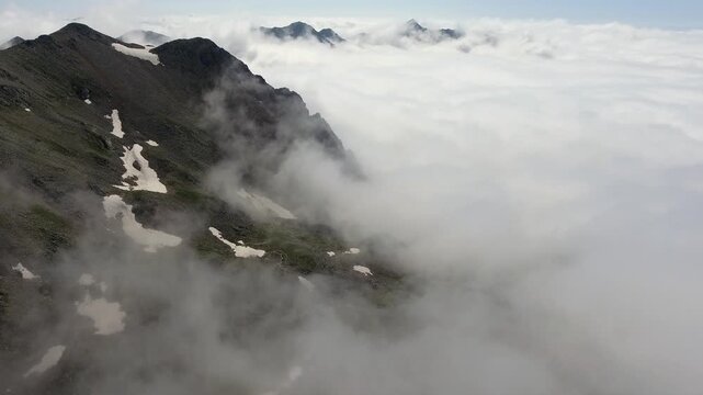 Eastern Black Sea Mountains in Rize Turkey rise above clouds with rugged ridges and misty peaks.