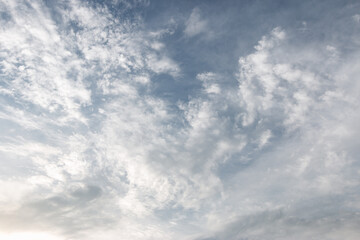 Fototapeta premium blue sky with a dramatic scattering of white clouds. blue sky background.