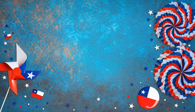 Pinwheel, fans, and flags celebrating chile fiestas patrias on blue background