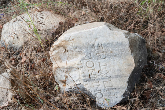 Ancient Greek Marble Inscription Fragment at Archaeological Site