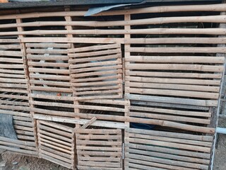 Outdoor bamboo chicken coop cage construction close up © deasi