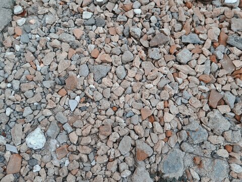 Crushed limestone and broken brick gravel surface texture background