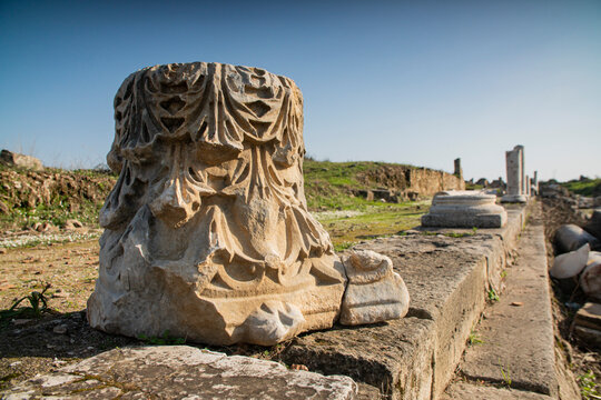 Ornate ancient Roman marble column capital with floral carved relief  archaeological site in Turkey