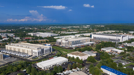 Obraz na płótnie Canvas Large data center campus buildings under construction aerial view in Virginia